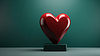 3D red heart sculpture on green background with sof | Stock Illustration