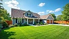 Beautiful suburban house with landscaped lawn, | Stock Illustration