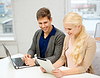 Photo 300 DPI: two teens with laptop and tablet pc at school