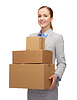 Smiling businesswoman holding cardboard boxes | Stock Foto