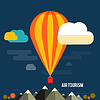 Vector clipart: Hot air balloon flying over mountain