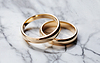 Gold wedding rings on marble background | Stock Foto