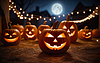 Photo 300 DPI: glowing halloween pumpkins on blurred background, hallo