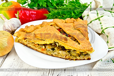 Pie with cabbage and sorrel in plate on light board | High resolution stock photo |ID 5711221