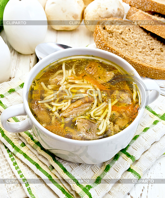 Soup with mushrooms and noodles in bowl on light | High resolution stock photo |ID 5711237