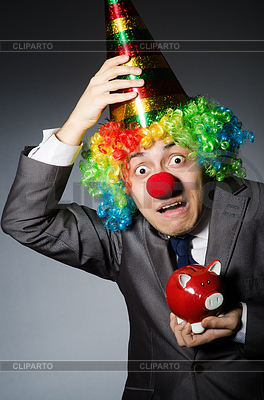Clown with piggybank in funny concept | High resolution stock photo |ID 4349507