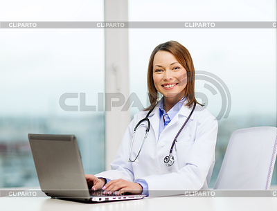 Busy doctor with laptop computer | High resolution stock photo |ID 4447805