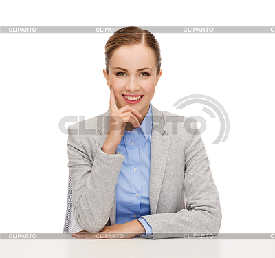 Smiling businesswoman sitting at table | High resolution stock photo |ID 4449553