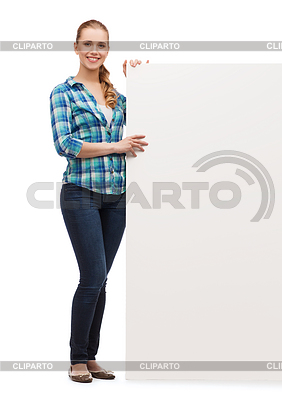Smiling young woman with white blank board | High resolution stock photo |ID 4449698