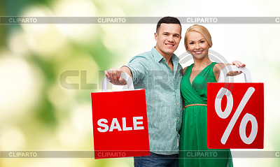 Pareja sonriente con bolsas de la compra | Foto de alta resolución |ID 4453142