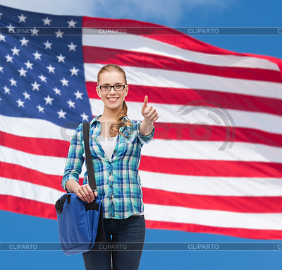 Student with laptop bag showing thumbs up | High resolution stock photo |ID 4460173