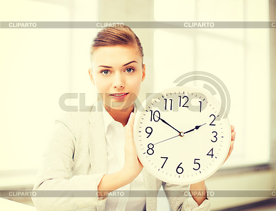 Attractive businesswoman showing white clock | High resolution stock photo |ID 4466654