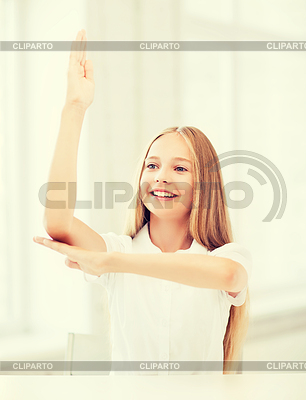 Student girl with hand up at school | High resolution stock photo |ID 4470643