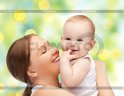 Happy mother with baby over green background | High resolution stock photo |ID 4741246