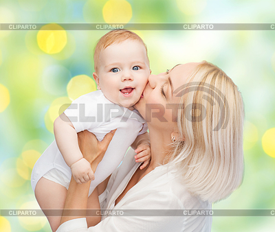 Happy mother with baby over green background | High resolution stock photo |ID 4741247