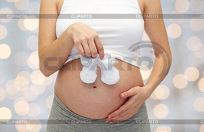 Беременная женщина с BABYS пинетки | Фото большого размера |ID 4913026