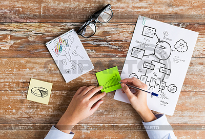 Hands drawing schemes on paper sheets | High resolution stock photo |ID 4932433
