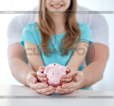 Family hands with piggy bank | High resolution stock photo |ID 4932449