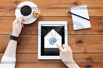 Woman with tablet pc on wooden table | High resolution stock photo |ID 5802799