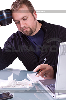 Young Casual Businessman Working at his Desk | High resolution stock photo |ID 4174384